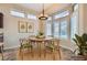 Bright dining room with modern lighting and natural accents, perfect for enjoying meals with Gathering and friends at 9920 Netherton Dr, Las Vegas, NV 89134