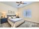 Serene main bedroom with comfortable furnishings, soft lighting, and a large window for natural light at 9920 Netherton Dr, Las Vegas, NV 89134
