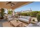 Inviting covered patio with comfortable seating, perfect for outdoor entertaining and relaxation at 9920 Netherton Dr, Las Vegas, NV 89134