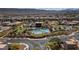 Gorgeous aerial shot of the community featuring a pool, clubhouse, and landscaped grounds, set against a mountain backdrop at , Las Vegas, NV 89135