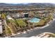 Beautiful aerial view of community clubhouse, pool, and green spaces with mountain views in the background at , Las Vegas, NV 89135