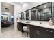 Modern bathroom with a large vanity, dual sinks, and a view into the glass-enclosed shower at , Las Vegas, NV 89135