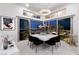Modern dining area featuring stylish chandelier and glass doors to outdoor patio at , Las Vegas, NV 89135