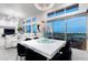 Open-concept living space boasts bright dining area with modern light fixture and floor-to-ceiling windows showcasing city views at , Las Vegas, NV 89135