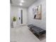 Contemporary entryway with tufted bench seating and textured accent wall at , Las Vegas, NV 89135