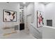 Bright hallway featuring a wine rack, console table and minimalist artwork at , Las Vegas, NV 89135