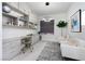 A modern home office featuring custom built-ins, sleek countertops, and a comfortable seating area at , Las Vegas, NV 89135