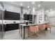 Modern kitchen with stainless steel appliances, a large island, and stylish bar seating at , Las Vegas, NV 89135