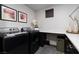 This laundry room features modern appliances, counter space, storage cabinets and decor at , Las Vegas, NV 89135