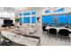 Modern living room with city views features plush seating, a dining area, and large windows at , Las Vegas, NV 89135