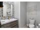 Stylish powder room features hexagon tile accent wall and modern floating vanity with a light countertop and sleek fixtures at , Las Vegas, NV 89135