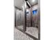 Walk-in shower with frameless glass enclosure features herringbone tile flooring and a rain shower head at , Las Vegas, NV 89135