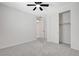 Bedroom featuring neutral carpet, a ceiling fan, and a closet at 10182 Skye Run Ave, Las Vegas, NV 89166