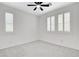 Bedroom featuring plantation shutters, neutral carpet, and a ceiling fan at 10182 Skye Run Ave, Las Vegas, NV 89166