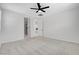 Large bedroom with ceiling fan, carpet, and ensuite bath at 10182 Skye Run Ave, Las Vegas, NV 89166