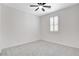 Bedroom featuring plantation shutters, neutral carpet, and a ceiling fan at 10182 Skye Run Ave, Las Vegas, NV 89166