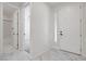 Foyer area featuring an entry door, marble tile flooring and access to a bedroom at 10182 Skye Run Ave, Las Vegas, NV 89166
