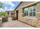 Close up of the front exterior with a paved driveway and walkway, and a gated courtyard at 10182 Skye Run Ave, Las Vegas, NV 89166