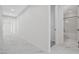 Hallway featuring neutral paint, white molding, and marble-look tile flooring at 10182 Skye Run Ave, Las Vegas, NV 89166