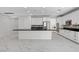 Spacious kitchen island featuring a black countertop and white cabinets at 10182 Skye Run Ave, Las Vegas, NV 89166