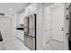 Kitchen view with stainless steel refrigerator and white cabinetry at 10182 Skye Run Ave, Las Vegas, NV 89166