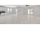 Open floorplan with a kitchen, dining and living space with tile floors and recessed lighting at 10182 Skye Run Ave, Las Vegas, NV 89166