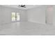 Spacious living space with tile floors, recessed lighting, and french doors to the backyard at 10182 Skye Run Ave, Las Vegas, NV 89166