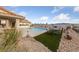 Inviting backyard features a pool, patio area, and desert-friendly landscaping at 1060 Calico Ridge Dr, Henderson, NV 89011