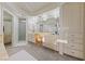 Bright bathroom featuring double sinks, ample counter space, and vanity area with natural lighting at 1060 Calico Ridge Dr, Henderson, NV 89011
