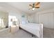 Sun-filled bedroom with ceiling fan and plush carpeting offers great space and natural light at 1060 Calico Ridge Dr, Henderson, NV 89011