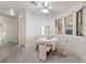 Bright dining area with large windows, a ceiling fan, and carpeted flooring at 1060 Calico Ridge Dr, Henderson, NV 89011
