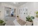 Bright foyer with tile flooring, decorative front door, and an open view to the adjacent office space at 1060 Calico Ridge Dr, Henderson, NV 89011