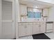 Kitchen featuring white cabinets, modern appliances, and plenty of storage space at 1060 Calico Ridge Dr, Henderson, NV 89011