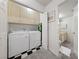 Laundry room with modern washer and dryer, and plenty of built-in cabinet storage at 1060 Calico Ridge Dr, Henderson, NV 89011