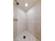Tiled walk-in shower with rainfall showerhead for a spa-like experience at 1060 Calico Ridge Dr, Henderson, NV 89011