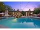 Backyard pool and spa with seating areas and manicured landscaping at 10674 Chillingham Dr, Las Vegas, NV 89183