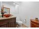 Bathroom displaying a granite vanity, vessel sink, with a wood framed mirror at 10674 Chillingham Dr, Las Vegas, NV 89183