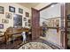 Grand entryway with a piano, ornate rug, and a view into the game room with a pool table at 10674 Chillingham Dr, Las Vegas, NV 89183