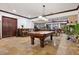 Enjoy the game room with a pool table and access to other entertainment spaces at 10674 Chillingham Dr, Las Vegas, NV 89183