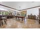 Expansive game room featuring a pool table, a fireplace, and plenty of space for entertainment at 10674 Chillingham Dr, Las Vegas, NV 89183