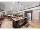 Bright kitchen features stainless steel appliances, granite countertops, and adjacent living space at 10674 Chillingham Dr, Las Vegas, NV 89183