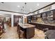 This kitchen features stainless steel appliances, granite counters and access to other living spaces at 10674 Chillingham Dr, Las Vegas, NV 89183