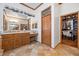 Bathroom vanity with double sinks and a walk in closet at 10674 Chillingham Dr, Las Vegas, NV 89183
