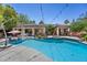 Backyard pool and patio with outdoor seating at 10674 Chillingham Dr, Las Vegas, NV 89183