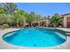 Inviting backyard pool with patio and lounge areas, perfect for outdoor relaxation at 10674 Chillingham Dr, Las Vegas, NV 89183