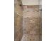 Walk-in shower featuring decorative stone tile at 10674 Chillingham Dr, Las Vegas, NV 89183
