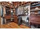 Custom walk-in closet with wood shelves, drawers, and plenty of hanging space at 10674 Chillingham Dr, Las Vegas, NV 89183
