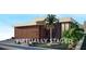 Contemporary home showcasing clean lines, stylish wood and marble accents, and drought-resistant landscaping at 1224 Powerpack Ct, Henderson, NV 89012