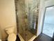Modern bathroom with glass enclosed shower and tiled accent at 1304 Bonita Ave, Las Vegas, NV 89104