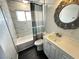 Modern bathroom features a stylish vanity and shower-tub combination with a shower curtain at 1304 Bonita Ave, Las Vegas, NV 89104